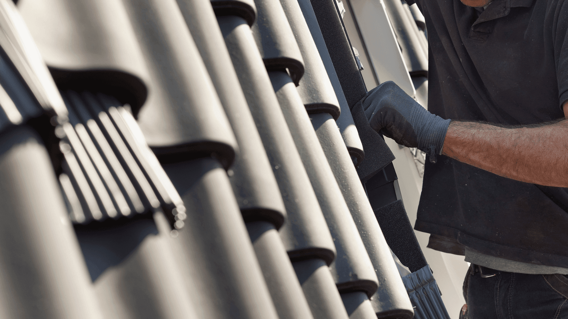 Professional roofer at work in North & East London